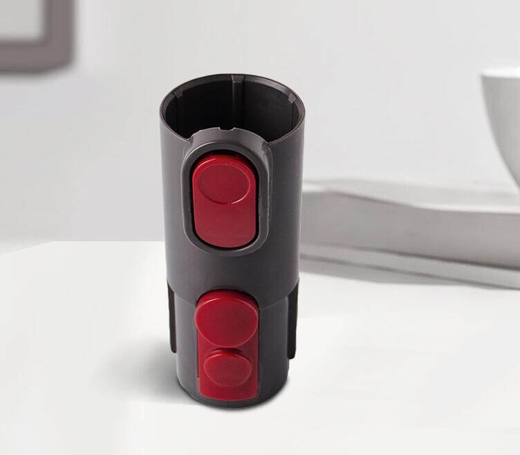 Pet grooming brush vacuum attachment with red buttons, designed for convenient shedding cleanup. 🐾✨